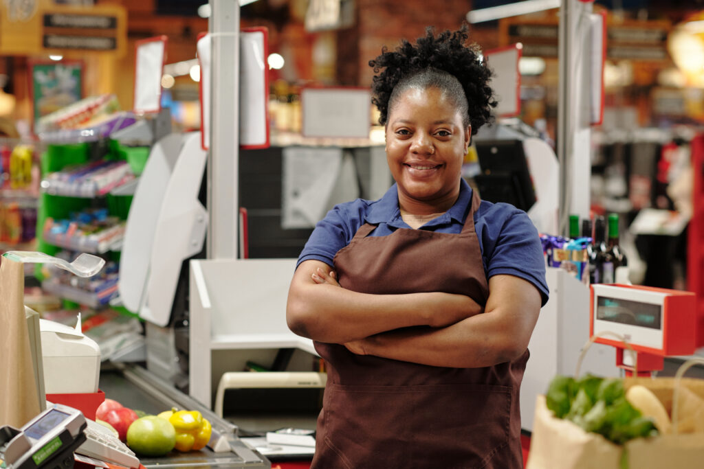 A teller happy as her employer makes use of EasyRoster retail workforce management software