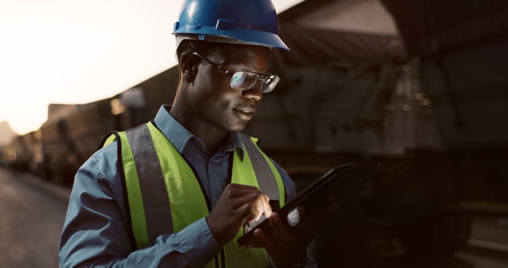 Mining contractor employee using a mobile device to view workforce information.