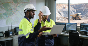 Mine operations team reviewing workforce deployment information for several mining sites.
