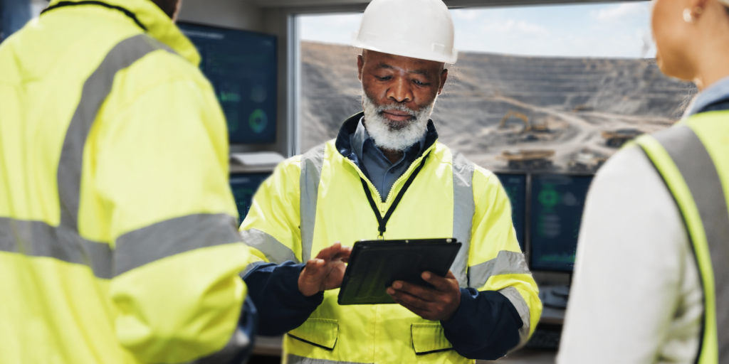 Mining operations team reviewing workforce shift plans at a Southern African mine site.