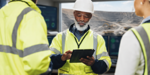 Mining operations team reviewing workforce shift plans at a Southern African mine site.